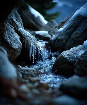 Ice water stream in the mountains photo