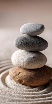 A stack of stones on top of a sand bed photo