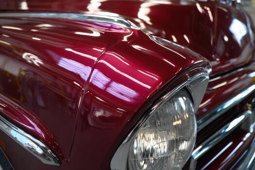 A close up of a red classic car photo