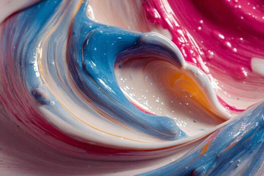 A close up of a colorful liquid with a swirl photo