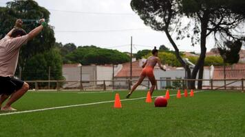 Engaging and Dynamic Training Session on the Sports Field Utilizing Cones and Additional Equipment video