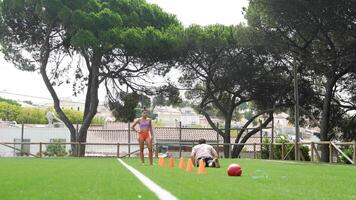 Engaging in a Training Session with Cones on a Dynamic Sports Field for Enhanced Performance video