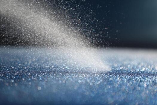 A close up of a white substance being sprayed onto a surface photo