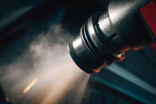 A close up of a machine spraying a substance photo