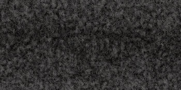 Detailed abstract surface featuring a dark, textured pattern with a complex and rough appearance. photo