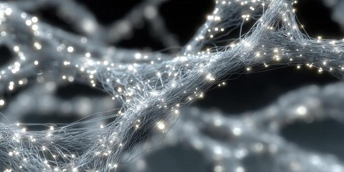 An abstract image of glowing fiber optic threads against a dark background. photo