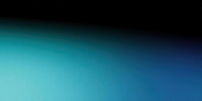 A captivating abstract gradient seamlessly transitions from teal to blue and black. photo