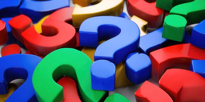 Colorful question marks in different colors create a vibrant visual representation of questions. photo