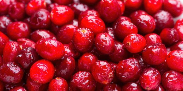 A close-up of a pile of ripe, red cranberries, ready to eat. photo
