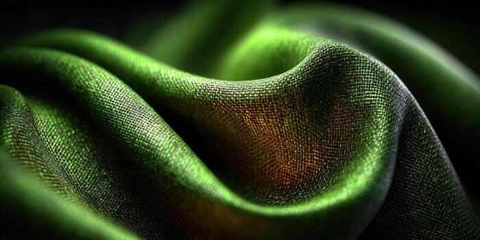 A close-up shot of a green fabric's elegant folds and textures. photo