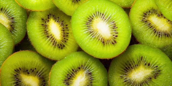 Vibrant green kiwi fruit slices create a refreshing and healthy pattern. photo