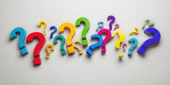 Colorful question marks scattered on a light background, representing questions and inquiries. photo
