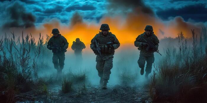 Soldiers in combat running through a misty field at dusk with weapons. photo