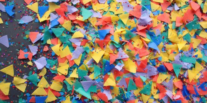 Colorful confetti creates a cheerful abstract background full of bright shapes. photo