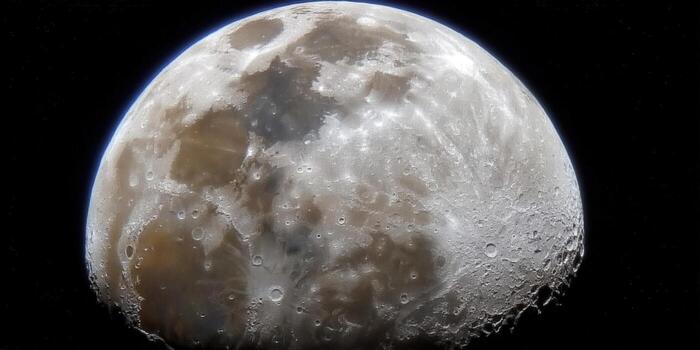 Detailed view of the moon, showcasing its surface, craters, and the vastness of space. photo
