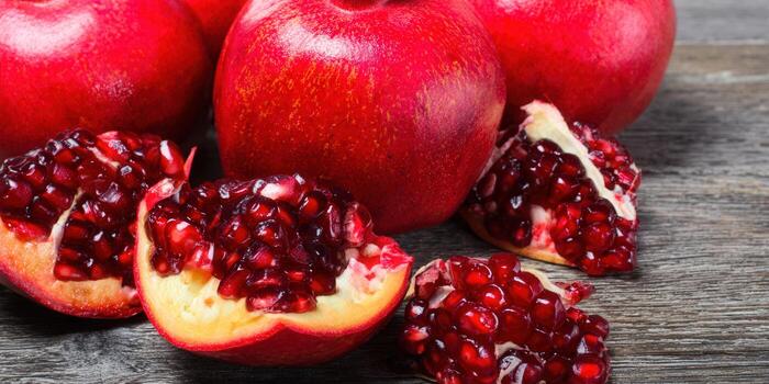 Vibrant pomegranates, showcasing the ruby-red seeds of this delicious and healthy fruit. photo