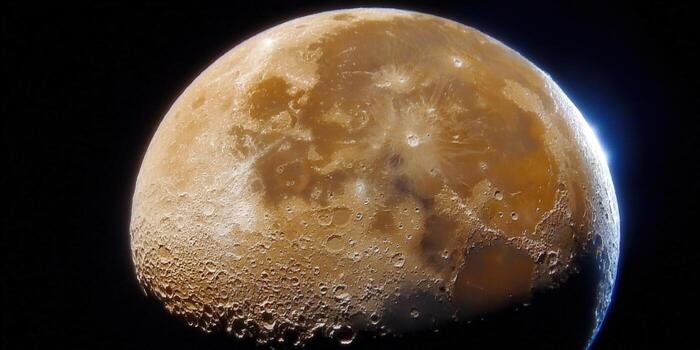 The moon glows in a captivating celestial display with textured craters in high definition. photo
