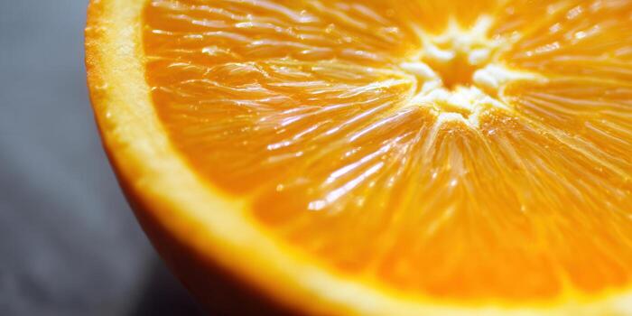 A close-up view of an orange slice reveals its refreshing details. photo