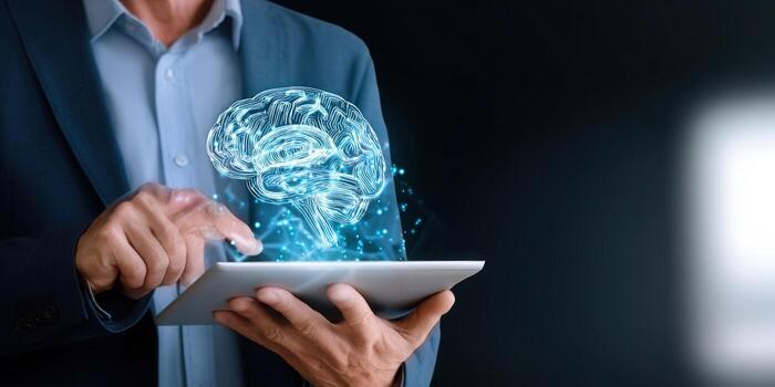 Businessman interacting with a digital brain on a tablet, symbolizing technology photo
