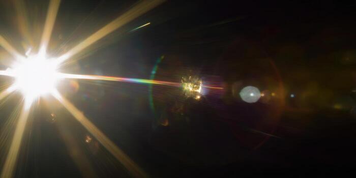 A beautiful light flare radiates with vibrant colors, creating a dramatic visual effect. photo
