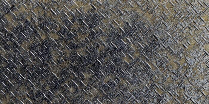 Close-up of a weathered diamond plate metal surface, ideal for industrial and abstract designs. photo