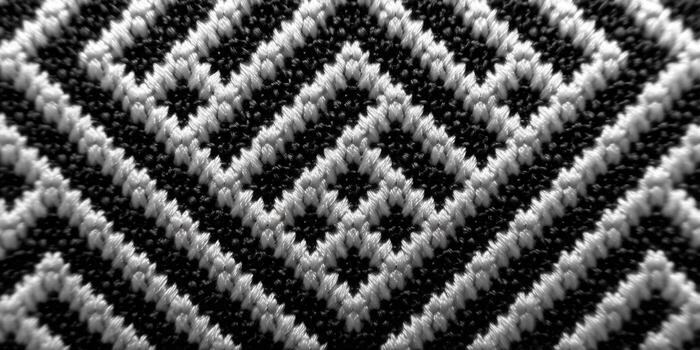 Intricate black and white weave forms a captivating geometric pattern. photo
