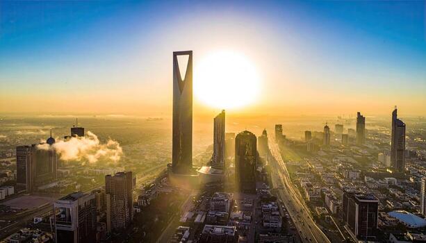 The sun is setting over a city skyline photo