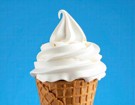 Close-up of a vanilla soft serve ice cream cone photo