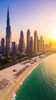 Aerial view of Dubai skyline at sunset, beach, and ocean photo