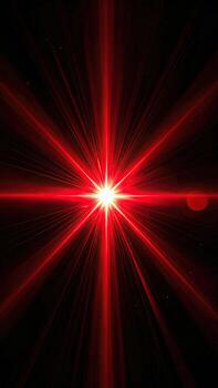 Fiery red starburst explosion on black photo