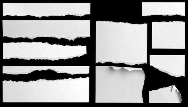 Collection of torn pieces of white paper on black background. Various shapes and sizes of ripped edges. Clean, crisp image photo