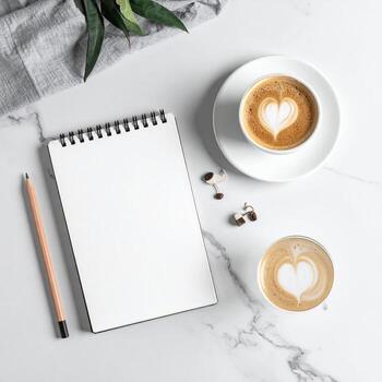 Flat lay of a blank notebook, coffee, and accessories on a marble surface photo