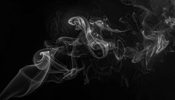 Abstract smoke swirls against a black background photo