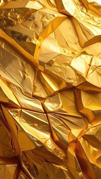 Close-up view of a gold-colored, textured surface. Abstract, multifaceted shapes and reflective facets create a rich, gleaming effect photo