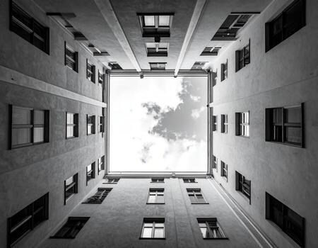 Black and white view up to a skylight courtyard photo