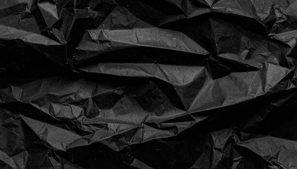 Deep black crumpled paper texture photo