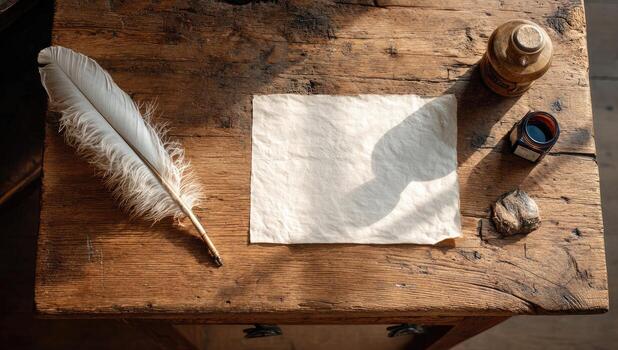 An old paper, quill and ink on a wooden table photo