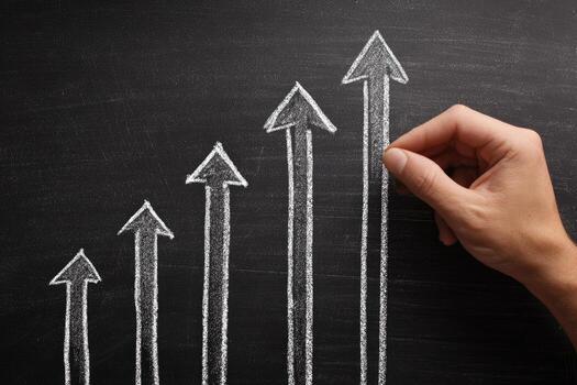 Hand drawing arrows on blackboard with growth chart photo