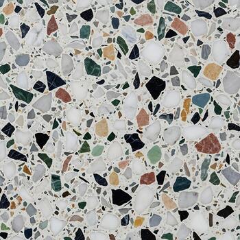 Smooth terrazzo polished surface background top view with scattered stone particles photo