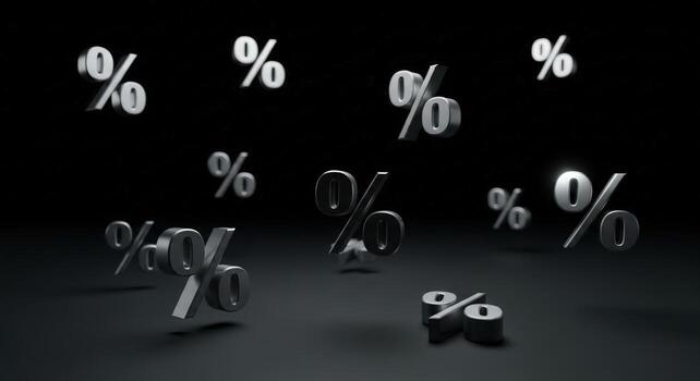Silver percentage signs floating against a dark background with soft lighting and reflections present photo