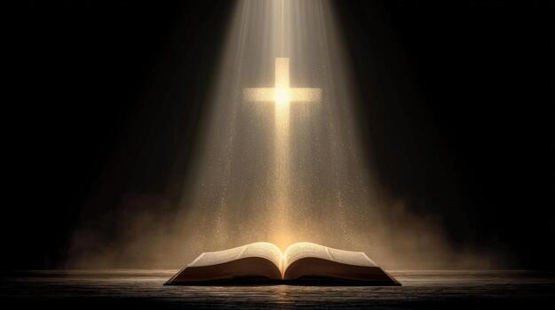 Open book with light shining on it and a cross in the background in a dark and mysterious setting photo