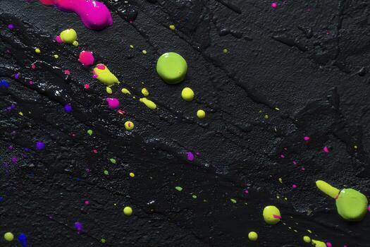 Vibrant abstract expressionism with colorful paint splatters on textured black surface photo