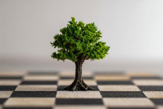 miniatura árbol en pie solo en un negro y blanco tablero de ajedrez simbolizando crecimiento y estrategia en un conceptual ambiente con suave atención antecedentes foto