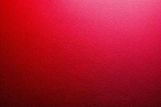 Close-up of vivid red textured wall surface with subtle light gradient creating a vibrant and dynamic background for creative design or artistic projects photo