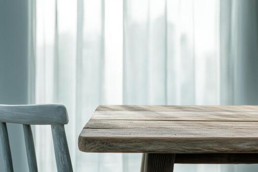 Cozy wooden table and chair with soft curtains in bright room setting photo