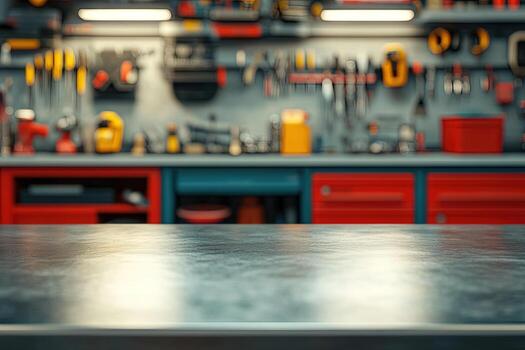 Gray workbench surface displays a blurred background with tool storage and a range of hand tools photo