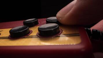 Finger pressing button on retro game controller video