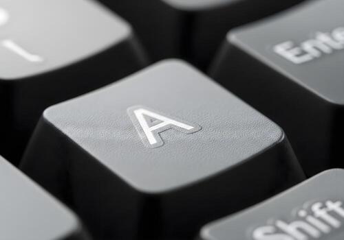 close up photograph of a computer button keyboard key photo