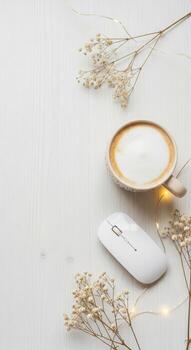 Cozy home office setup with coffee mug and computer mouse on a desk photo