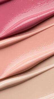 Luxurious swatches of makeup foundation and lipstick showcasing smooth textures and color tones photo